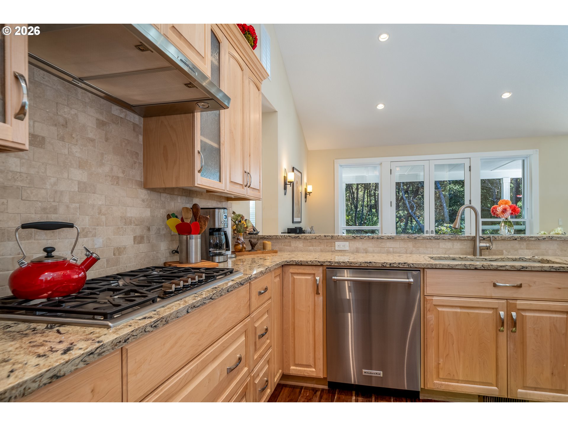 175 Southwest 59th Street South Beach, OR 97366 - Photo 24 of 48 a kitchen with granite countertop a sink stainless steel appliances and cabinets