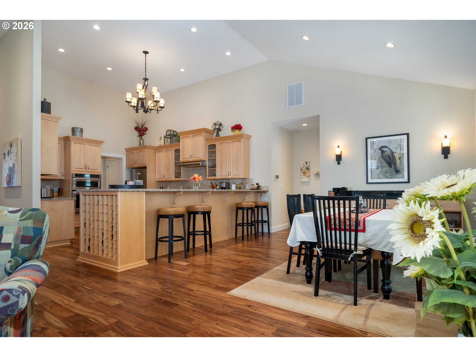 175 Southwest 59th Street South Beach, OR 97366 - Photo 26 of 48 a living room with kitchen island furniture and a chandelier