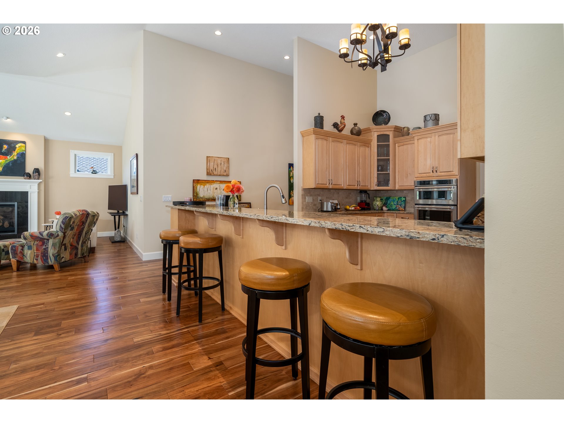 175 Southwest 59th Street South Beach, OR 97366 - Photo 27 of 48 a kitchen with stainless steel appliances granite countertop a sink a stove a dining table and chairs