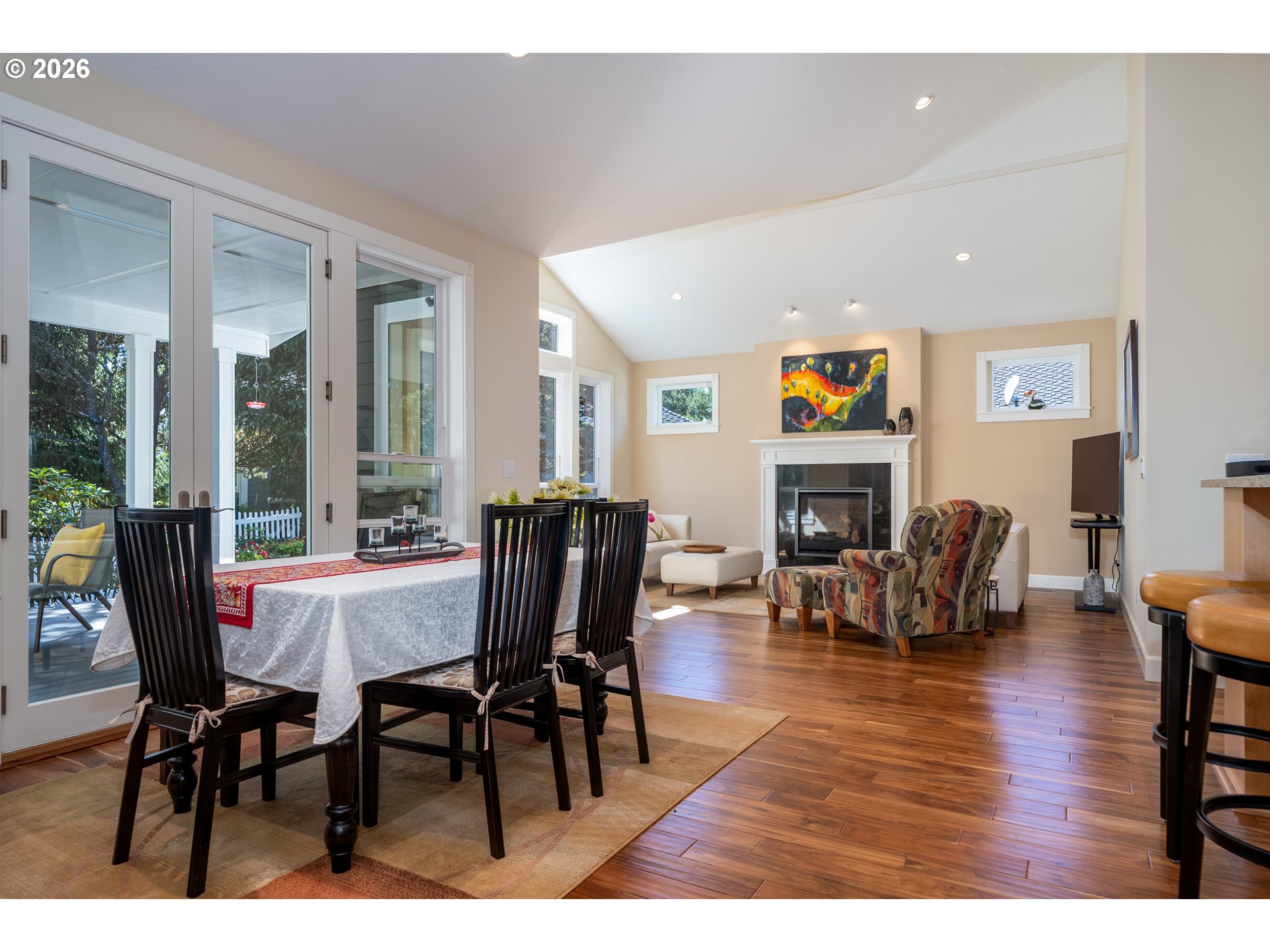 175 Southwest 59th Street South Beach, OR 97366 - Photo 29 of 48 a view of a dining room with furniture a fireplace and wooden floor