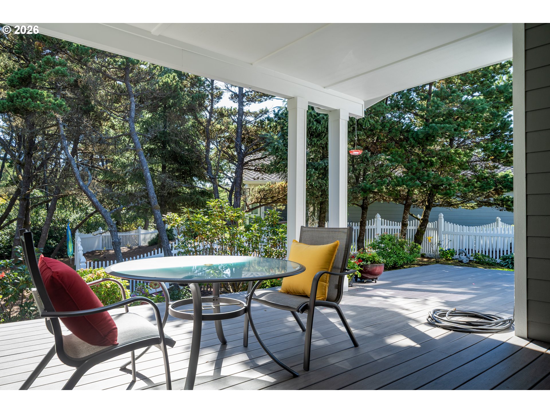 175 Southwest 59th Street South Beach, OR 97366 - Photo 32 of 48 a patio with yard glass top table and chairs