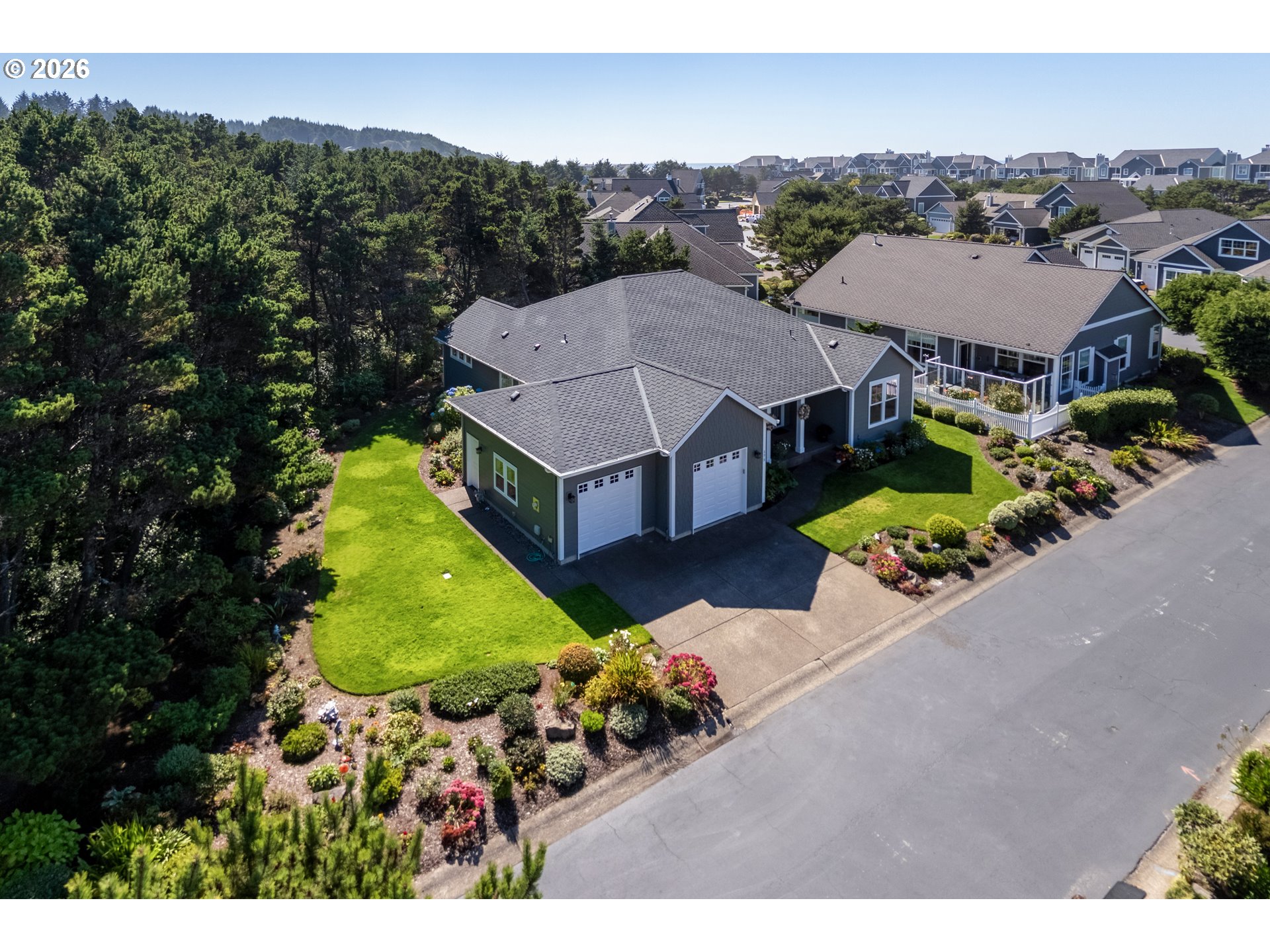 175 Southwest 59th Street South Beach, OR 97366 - Photo 4 of 48 an aerial view of a house with a garden