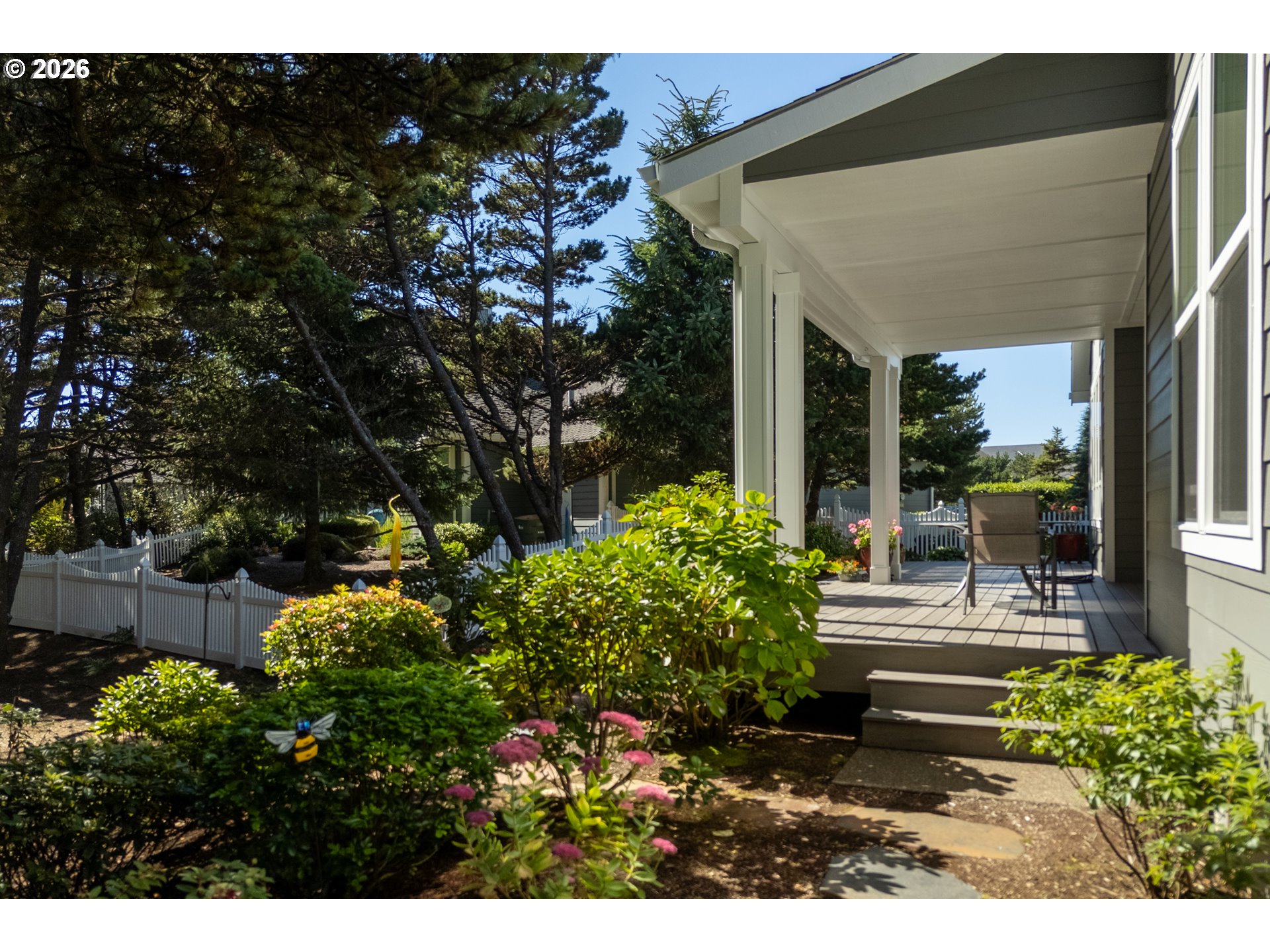 175 Southwest 59th Street South Beach, OR 97366 - Photo 10 of 48 a view of backyard with plants and outdoor seating