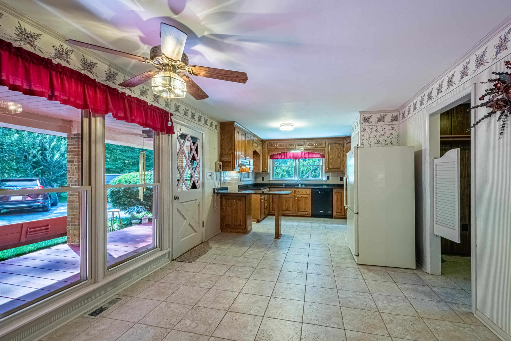 2842 Dog Branch Road Prospect, TN 38477 - Photo 14 of 50 a view of a kitchen with a refrigerator and a living room view
