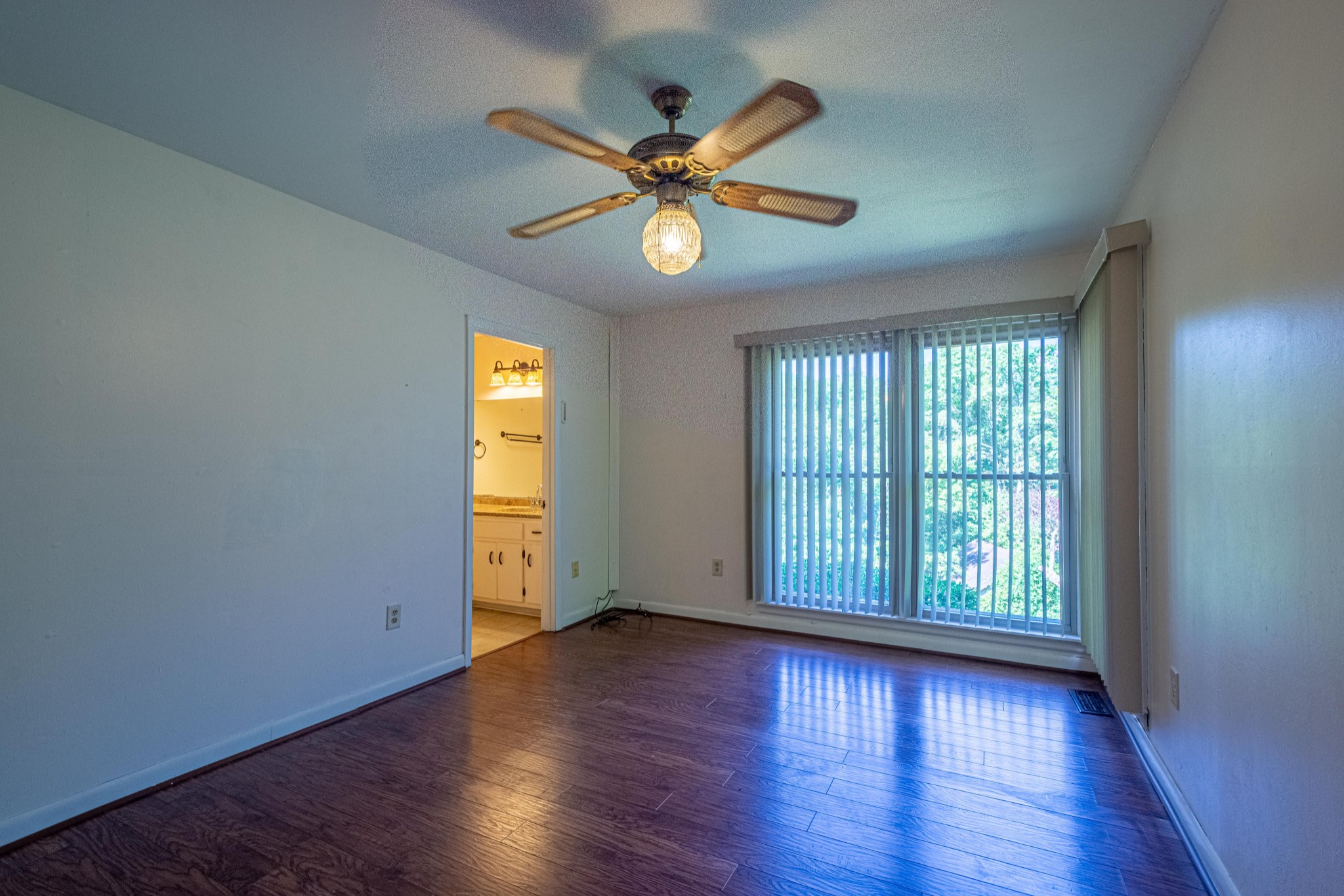 2842 Dog Branch Road Prospect, TN 38477 - Photo 28 of 50 an empty room with wooden floor fan and windows