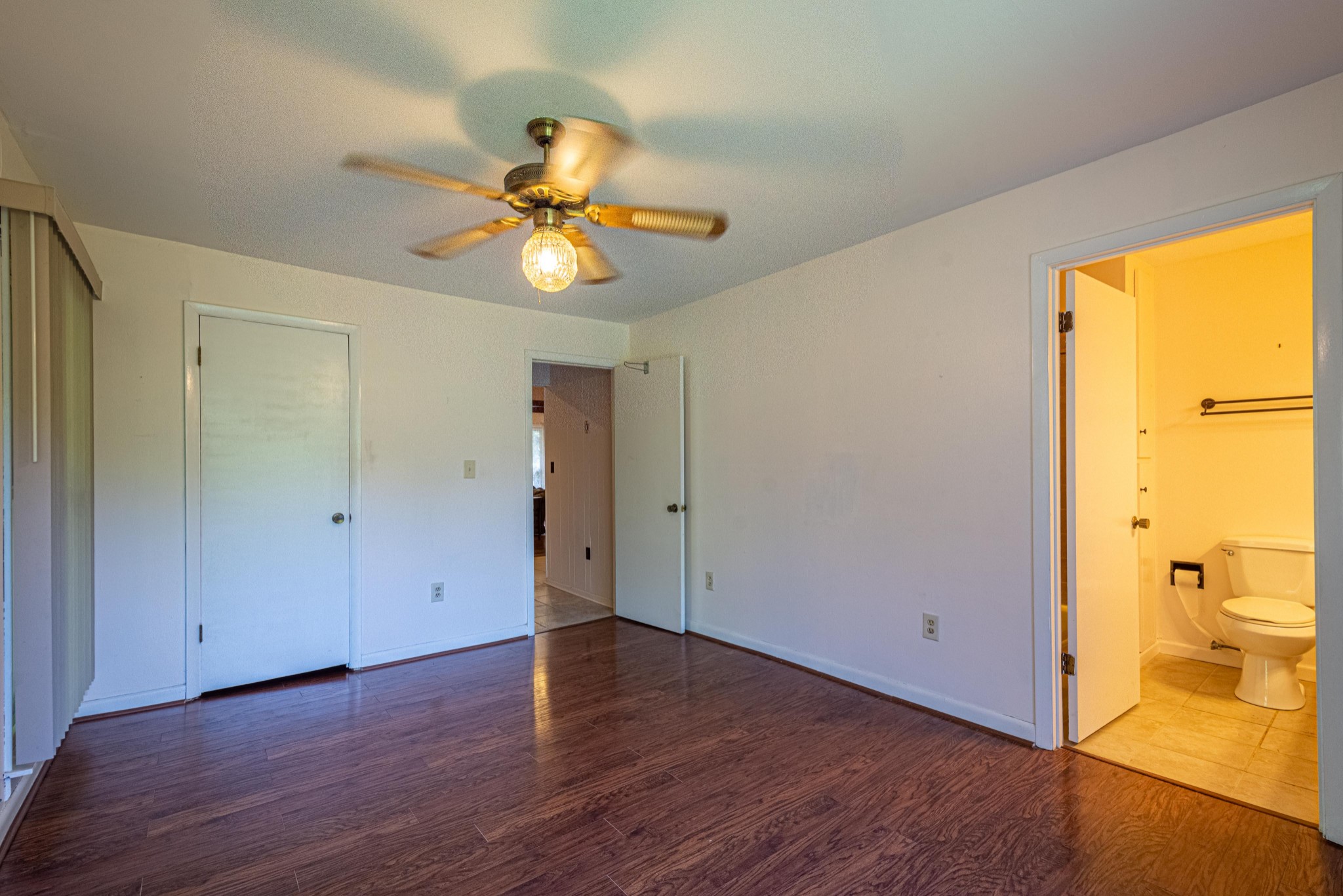 2842 Dog Branch Road Prospect, TN 38477 - Photo 29 of 50 a view of a livingroom with wooden floor and a ceiling fan