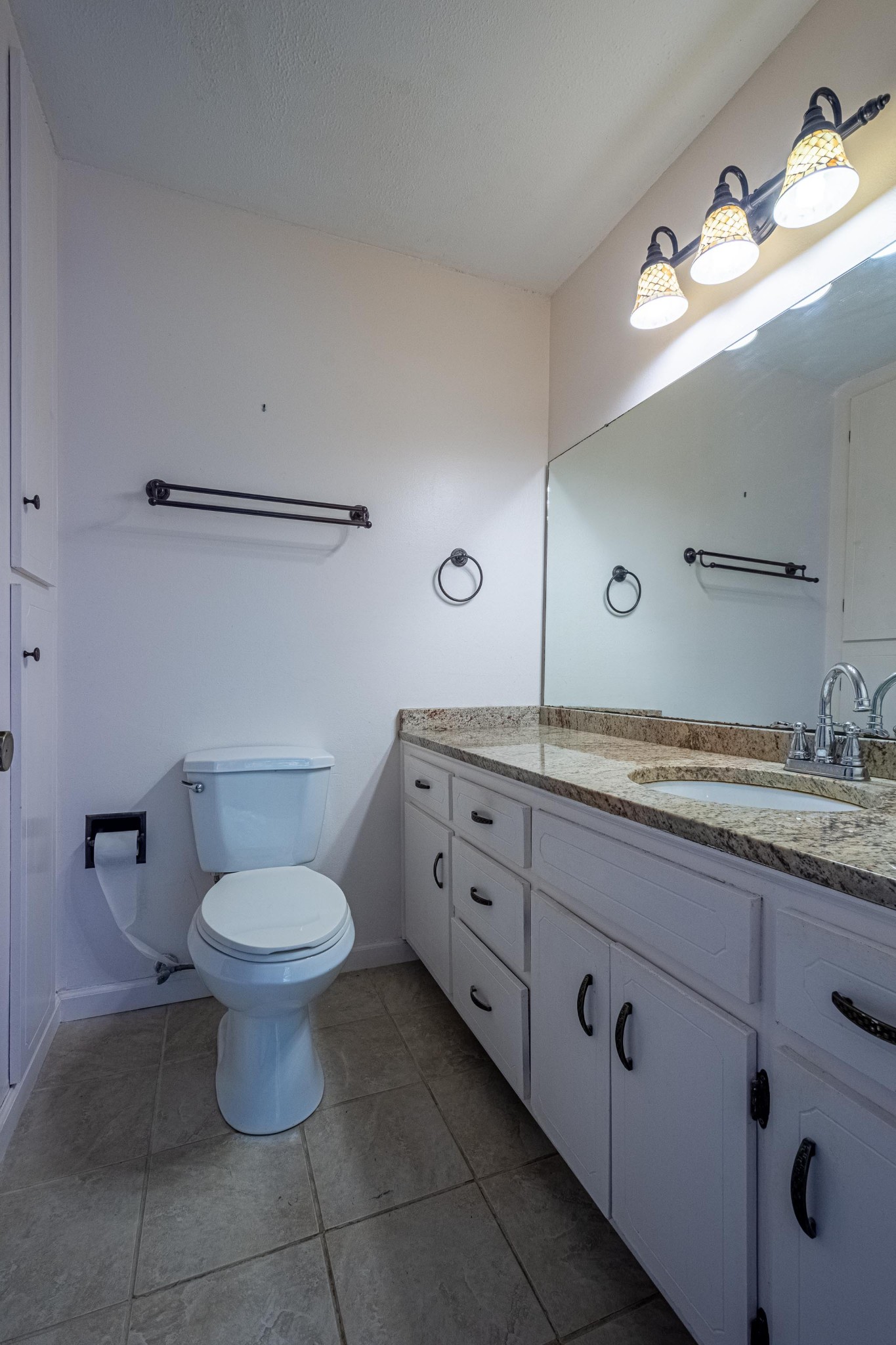 2842 Dog Branch Road Prospect, TN 38477 - Photo 30 of 50 a bathroom with a granite countertop sink a toilet and a mirror