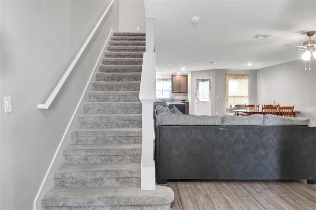 a view of living room with granite countertop furniture and wooden floor
