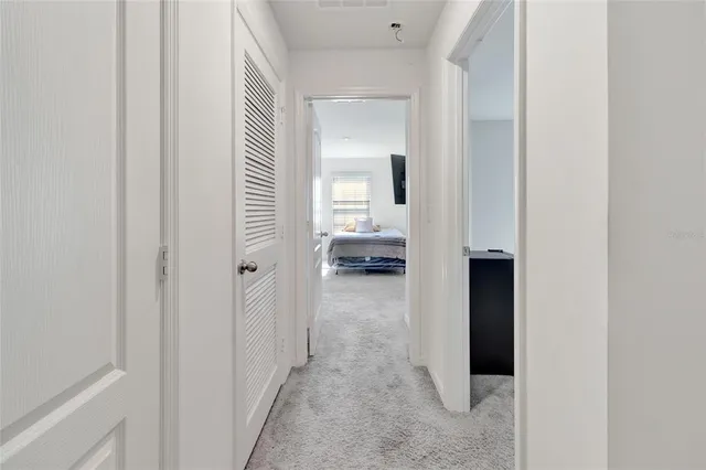 a view of a bedroom from hallway