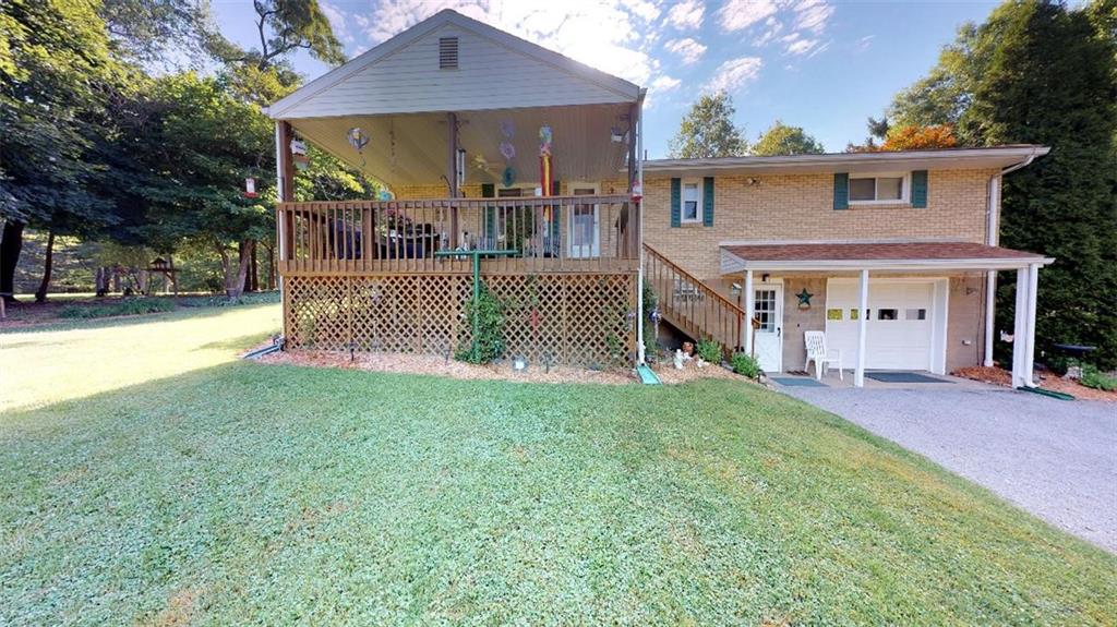 128 Cashdollar Road Mars, PA 16046 - Photo 2 of 24 Plenty of entertaining Space on this Oversized Deck which is off the kitchen! Driveway leads to the one car integral garage and continues to the 30x36 Detached Garage with Plenty of additional Room for Parking!