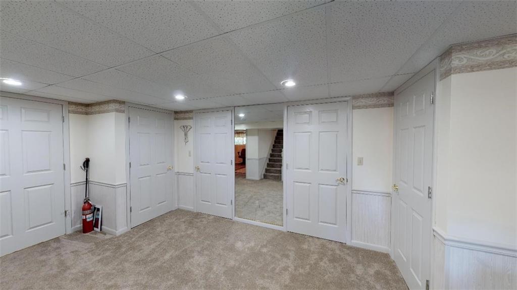 128 Cashdollar Road Mars, PA 16046 - Photo 23 of 24 Family Room with Plenty of Storage and walk out to the Gorgeous Private Level over an acre backyard!