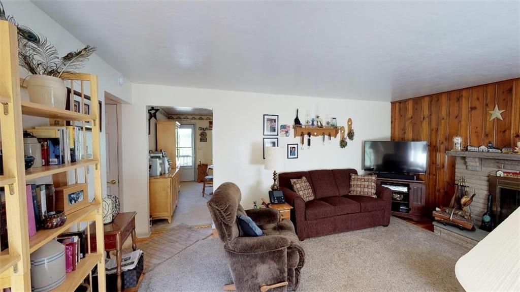 128 Cashdollar Road Mars, PA 16046 - Photo 10 of 24 Living Room features neutral Paint and Carpet, Wood Burning fireplace for those Chilly evenings! Plenty of Room for Entertaining!