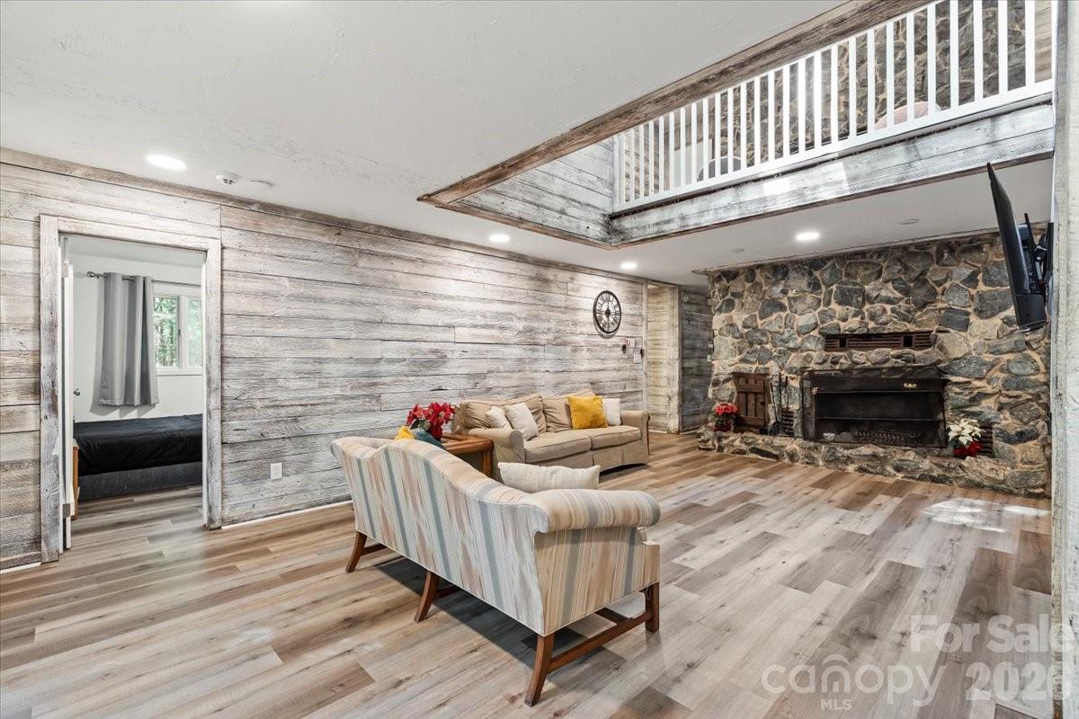 1715 Union Road Matthews, NC 28104 - Photo 11 of 41 a living room with furniture stairs and a fireplace