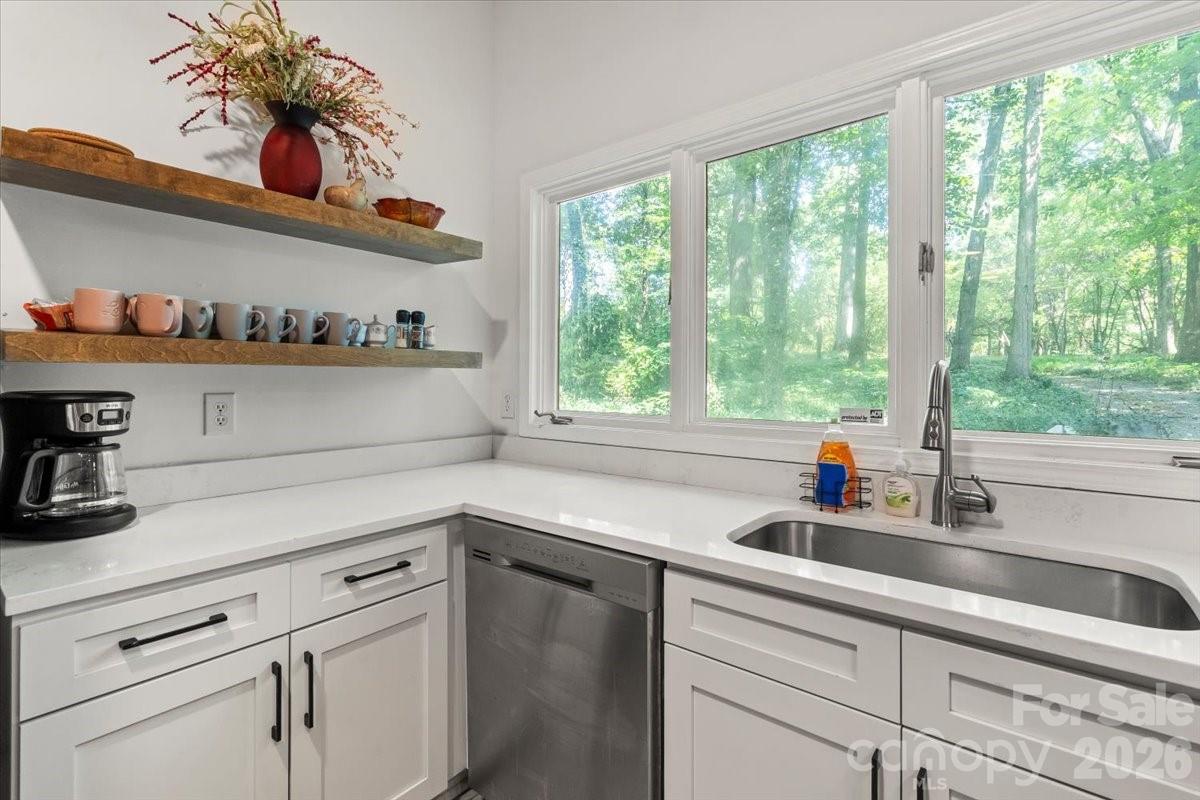 1715 Union Road Matthews, NC 28104 - Photo 18 of 41 a kitchen with stainless steel appliances white cabinets and a window