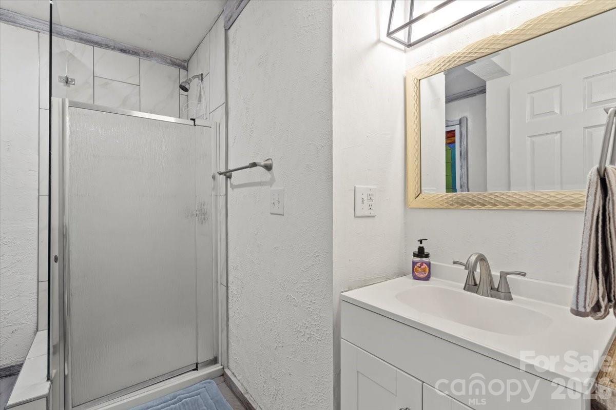 1715 Union Road Matthews, NC 28104 - Photo 27 of 41 a bathroom with a sink and a mirror