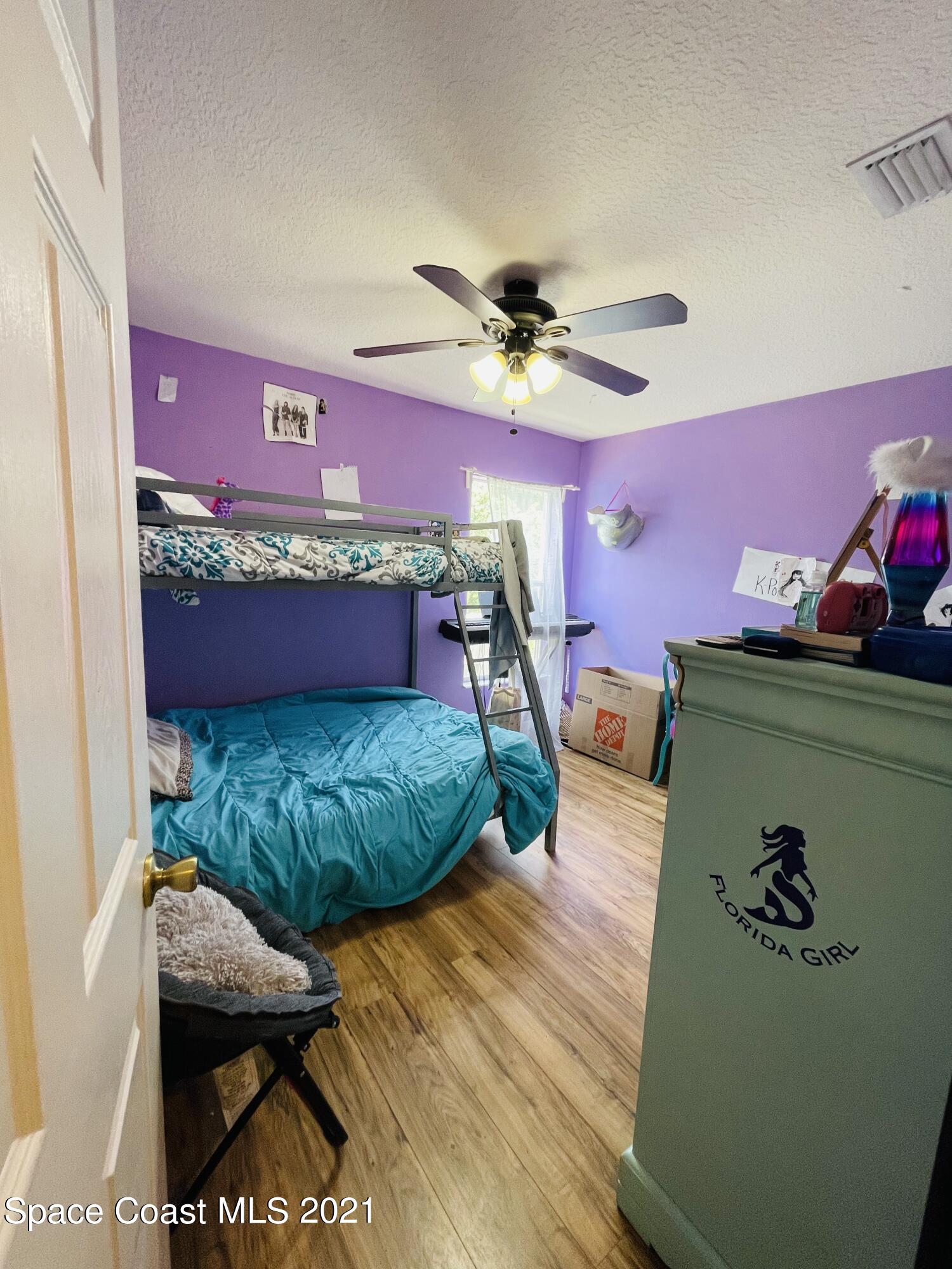 2374 Angel Road Palm Bay, FL 32909 - Photo 12 of 19 a bedroom with furniture and a window