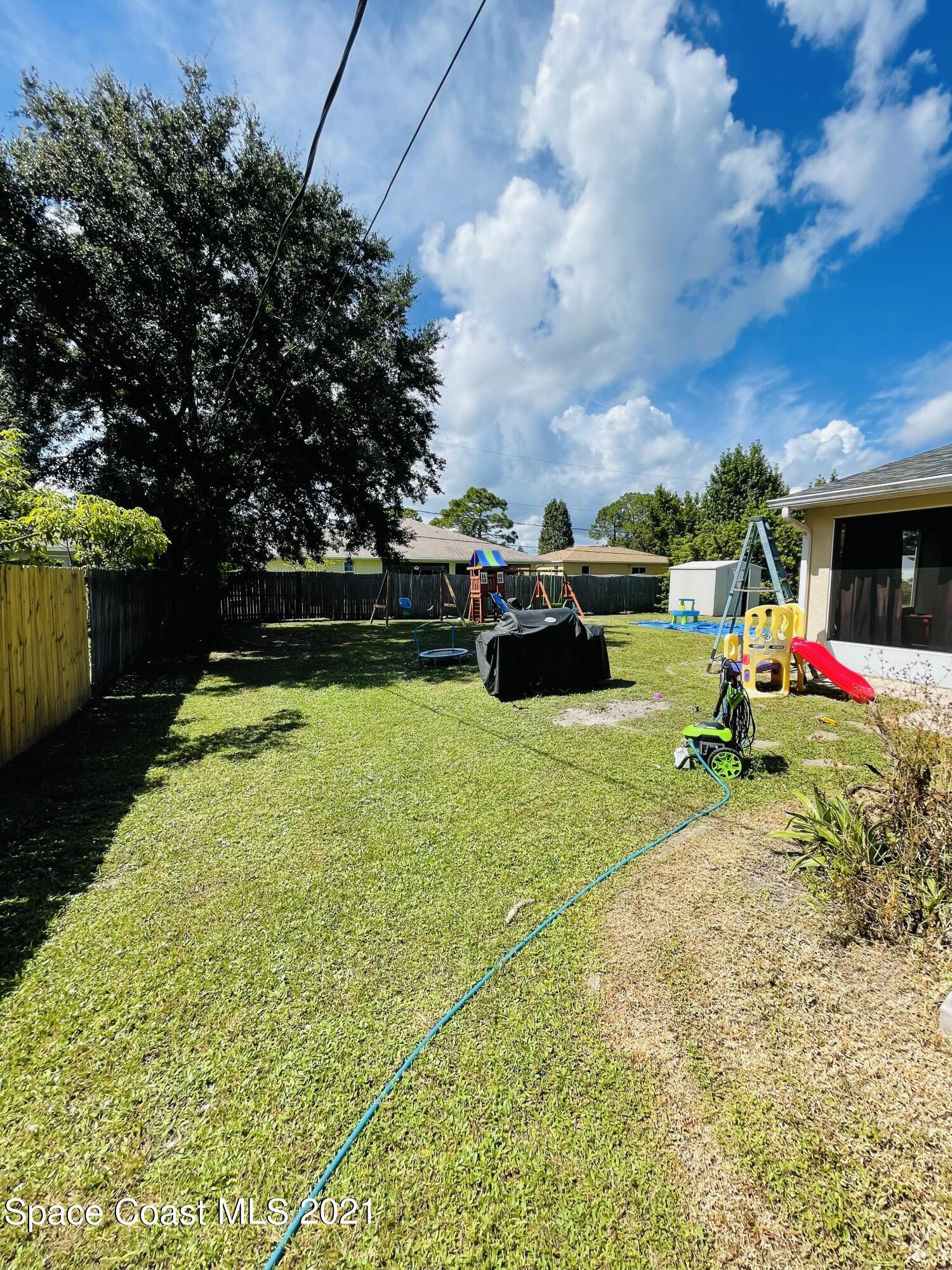 2374 Angel Road Palm Bay, FL 32909 - Photo 19 of 19 a utility room with dryer and washer