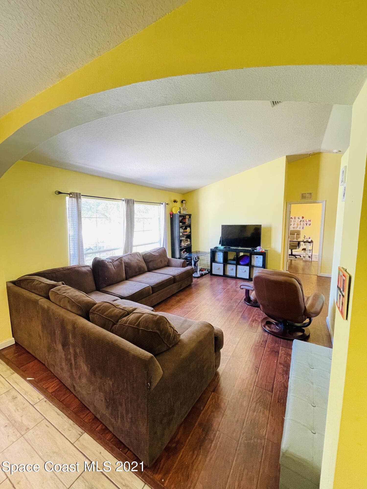 2374 Angel Road Palm Bay, FL 32909 - Photo 2 of 19 a living room with furniture and a lamp