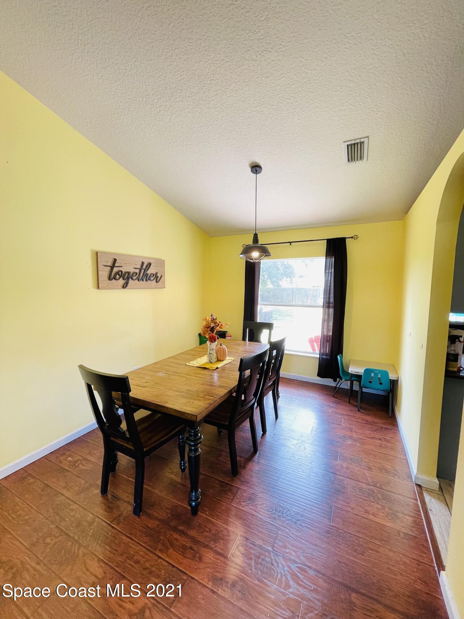 2374 Angel Road Palm Bay, FL 32909 - Photo 9 of 19 a living room with furniture and a table