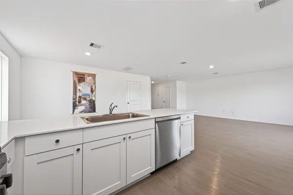 an empty room with a empty space and window