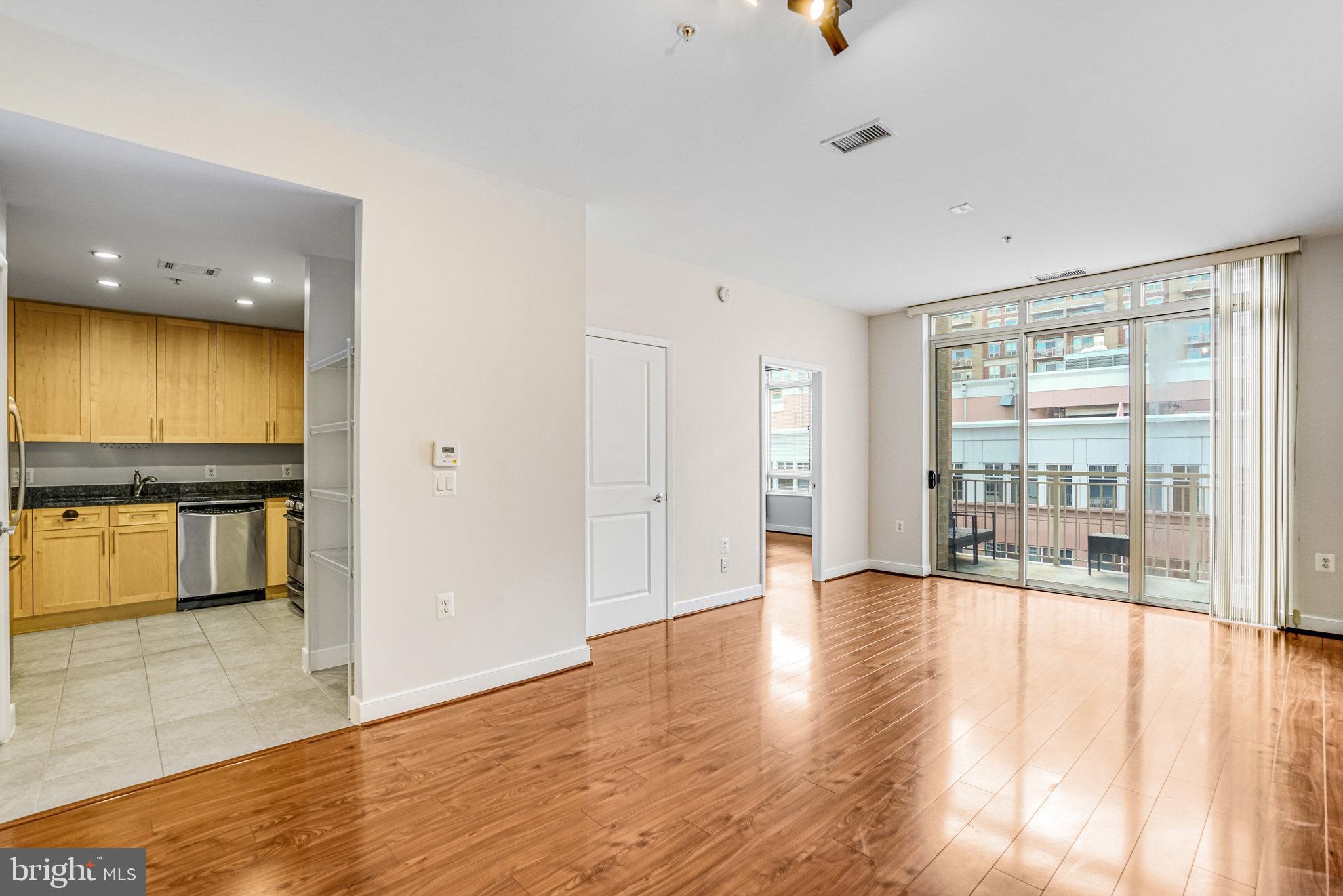 820 North Pollard Street, Unit 915 Arlington, VA 22203 - Photo 13 of 30 wooden floor in an empty room with a window