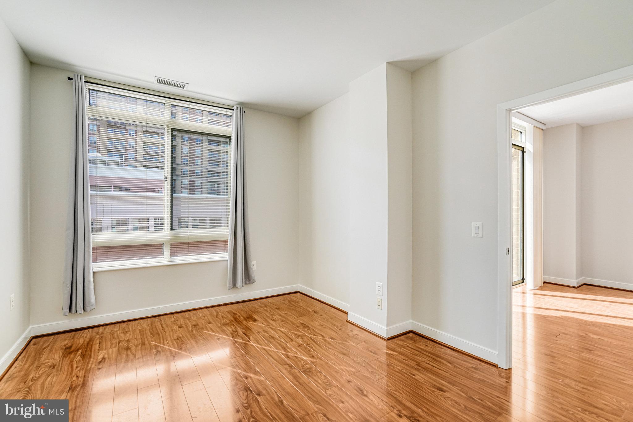 820 North Pollard Street, Unit 915 Arlington, VA 22203 - Photo 17 of 30 a view of empty room with wooden floor and fan