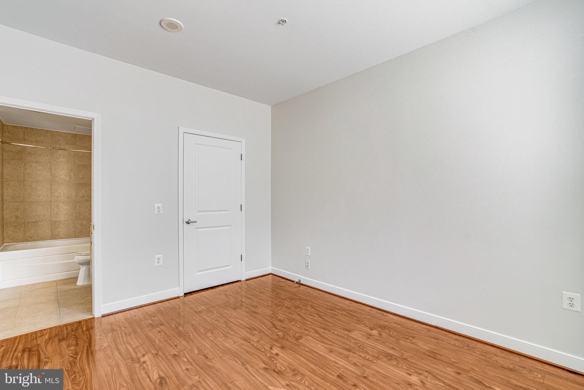 820 North Pollard Street, Unit 915 Arlington, VA 22203 - Photo 18 of 30 a view of empty room with wooden floor