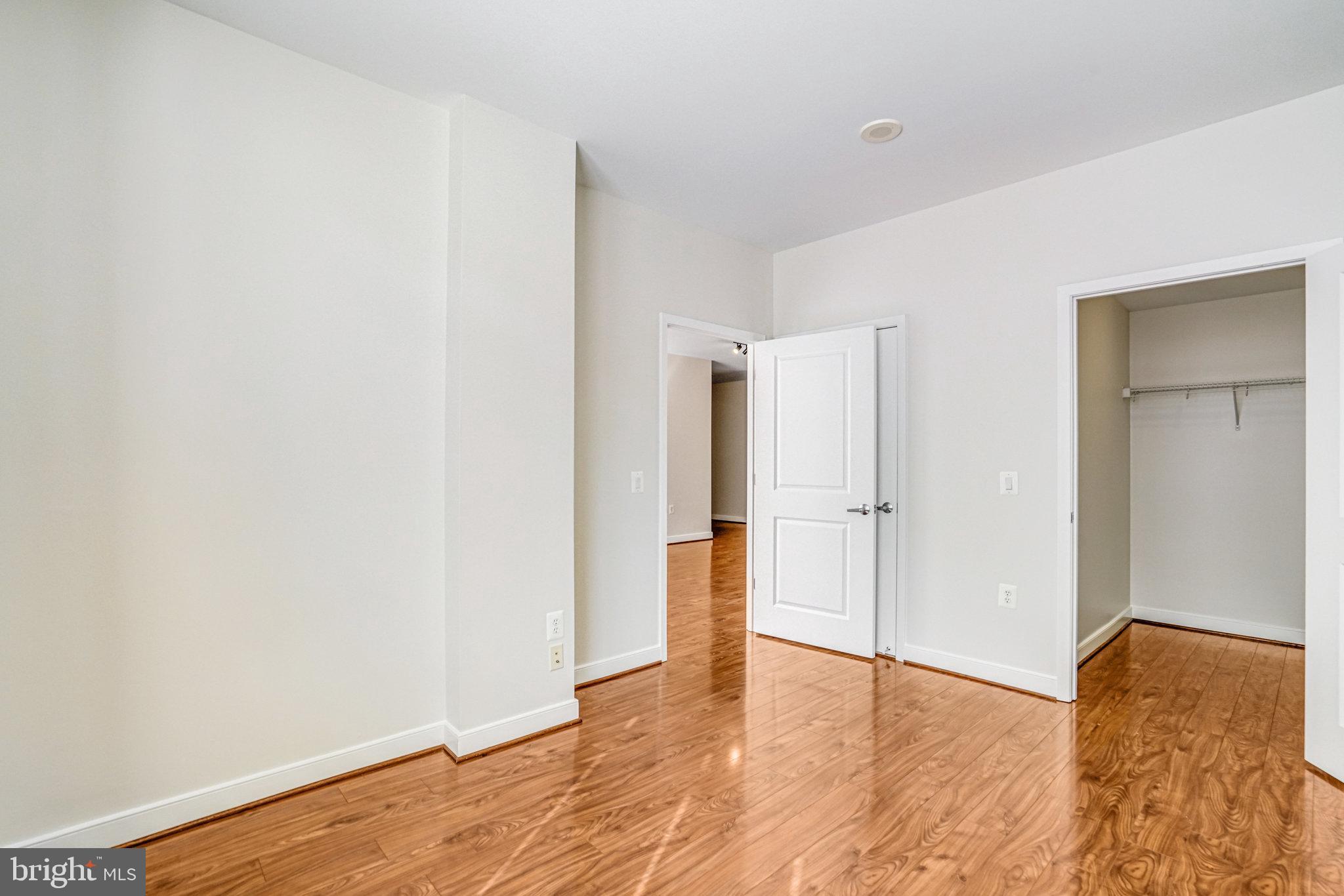 820 North Pollard Street, Unit 915 Arlington, VA 22203 - Photo 19 of 30 a view of empty room with wooden floor