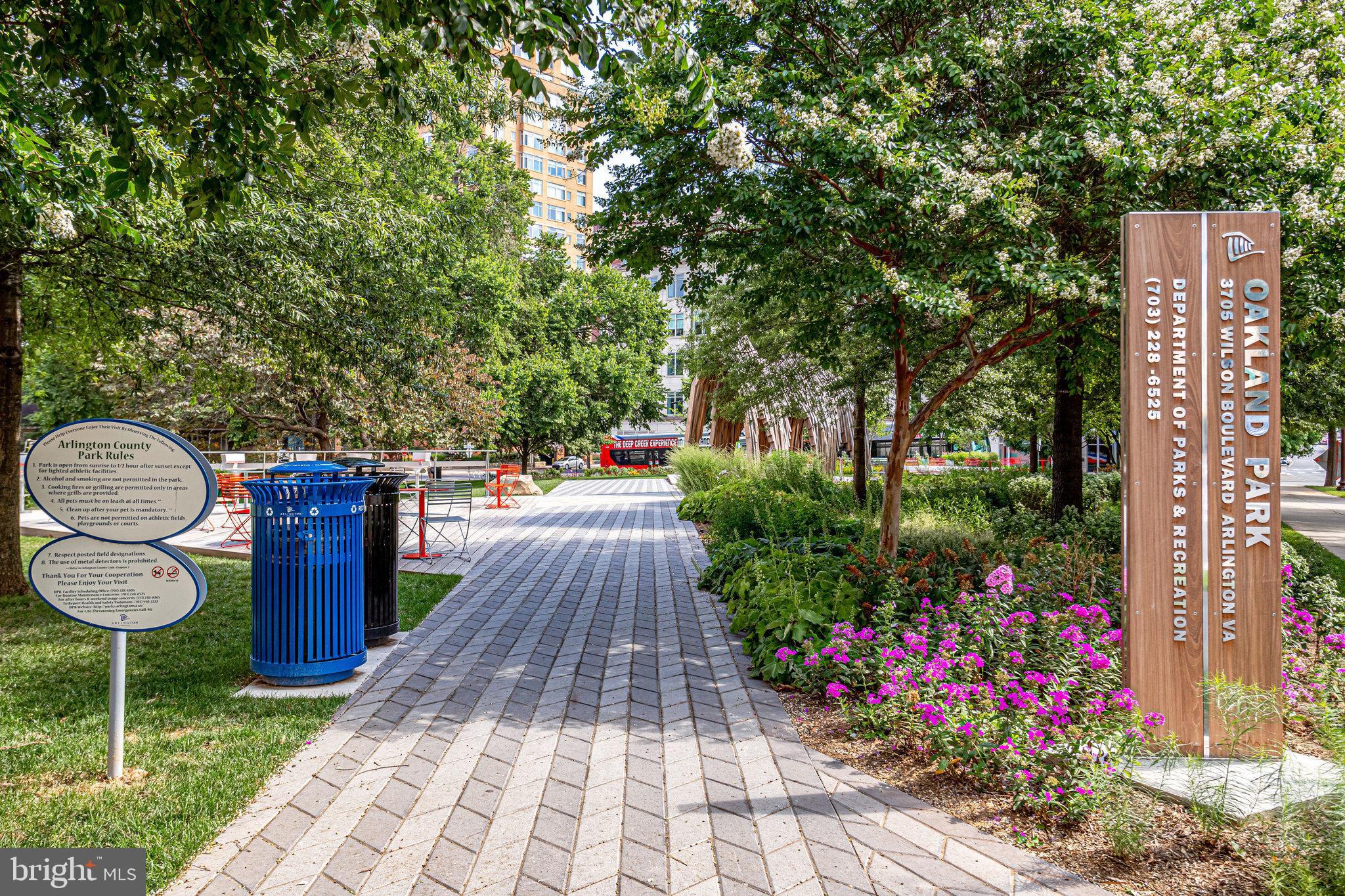 820 North Pollard Street, Unit 915 Arlington, VA 22203 - Photo 28 of 30 a patio with table and chairs and potted plants