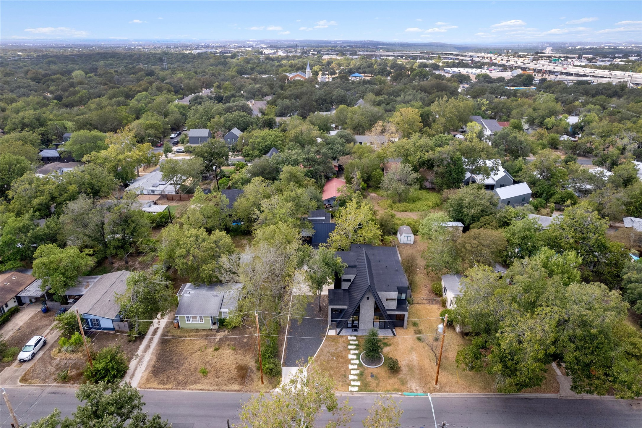 4506 Clawson Road, Unit 2 Austin, TX 78745 - Photo 17 of 19 From up here, you can see just how tucked away this modern structure is among the greenery. It offers a great mix of private residential living surrounded by mature trees while maintaining quick access to main thoroughfares.
