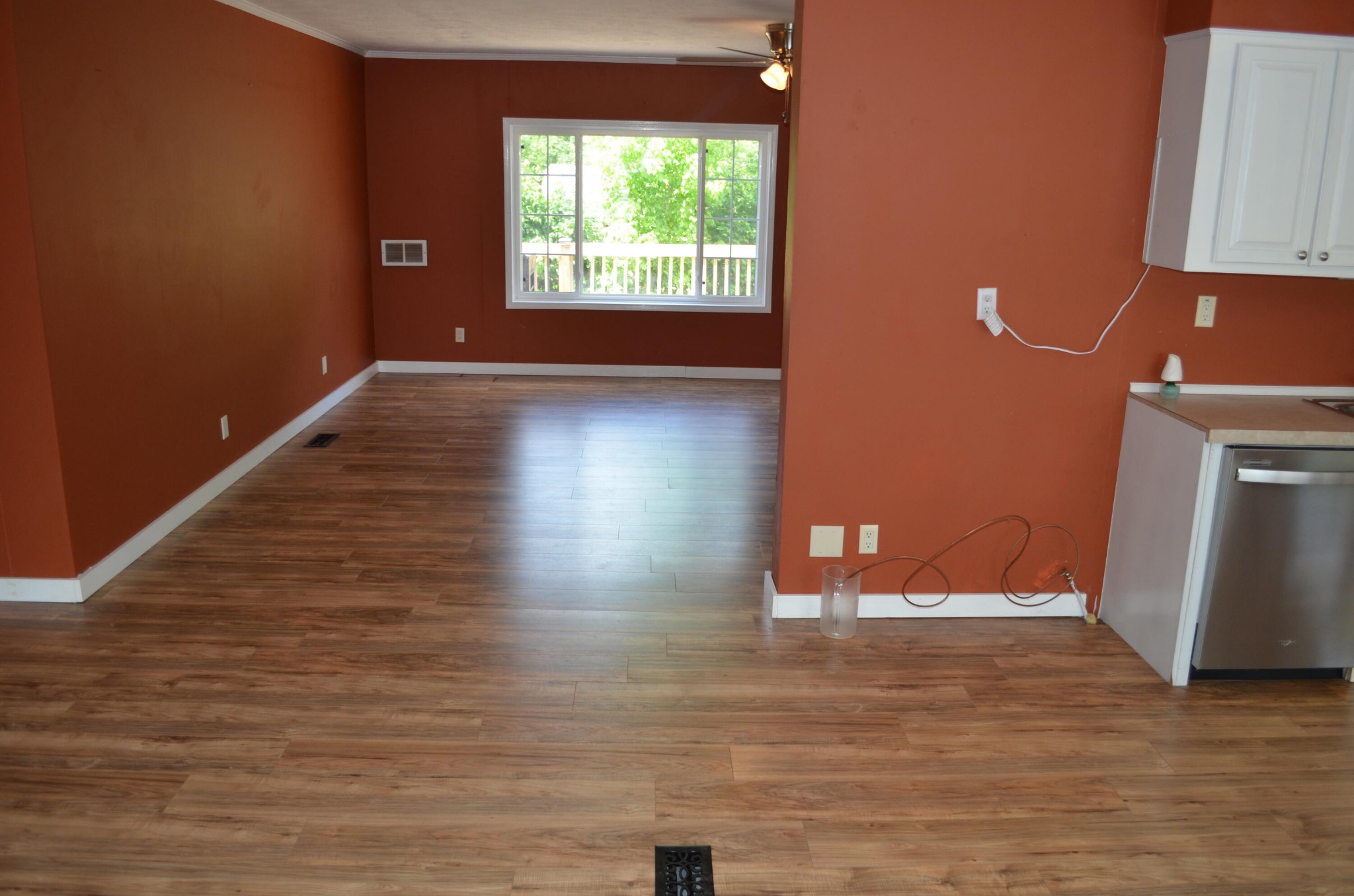 393 Busted Rock Road Old Fort, TN 37362 - Photo 3 of 43 a view of an empty room with wooden floor and a window