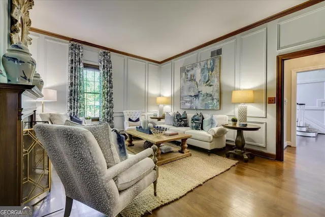 a kitchen with a table chairs refrigerator and cabinets
