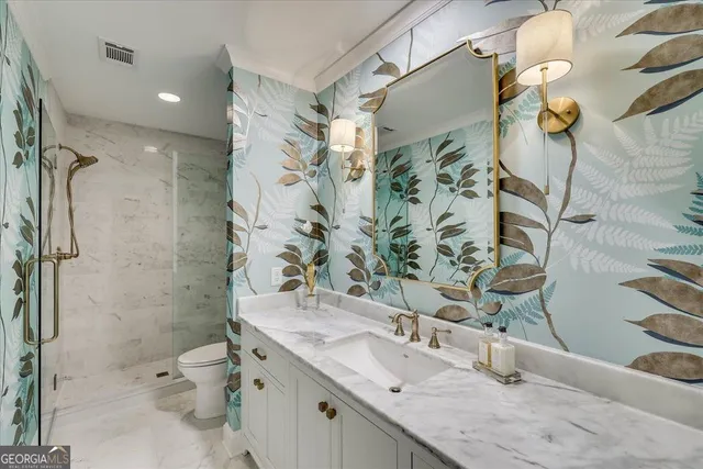 a close up of a stove in a white kitchen