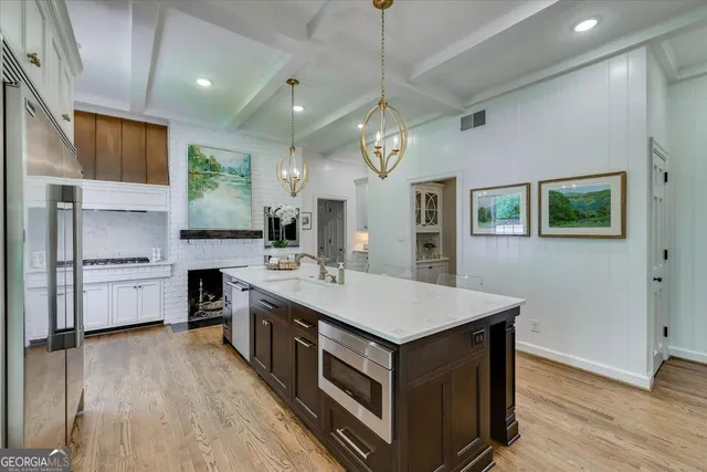 a view of a dining room with furniture and chandelier