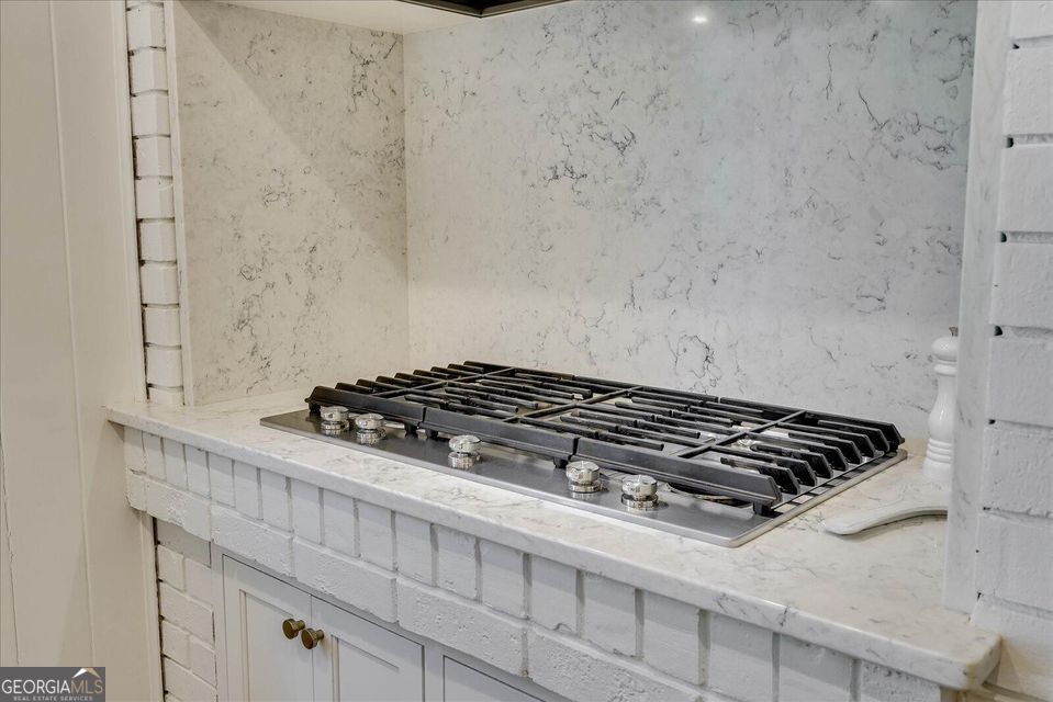 5 Prather Woods Lane Augusta, GA 30909 - Photo 21 of 73 a close up of a stove in a white kitchen