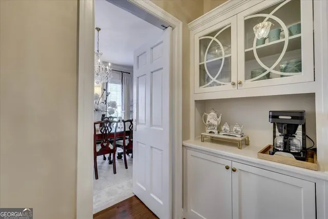 a bedroom with a bed and a lamp