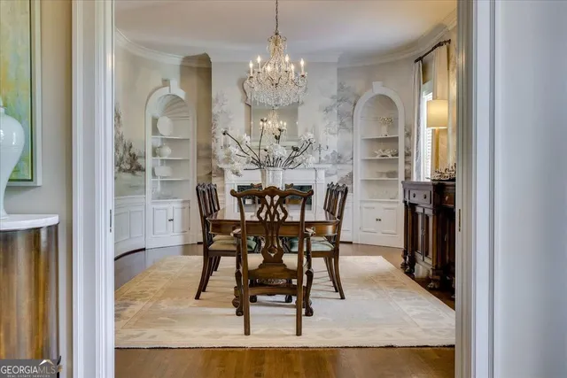 a bathroom with a sink a mirror a vanity and a shower