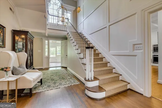 a bathroom with a granite countertop sink a shower and a mirror