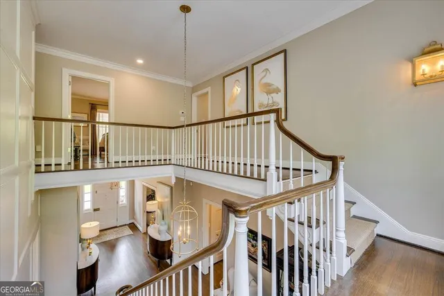 a bedroom with a bed and a flat tv screen on dresser