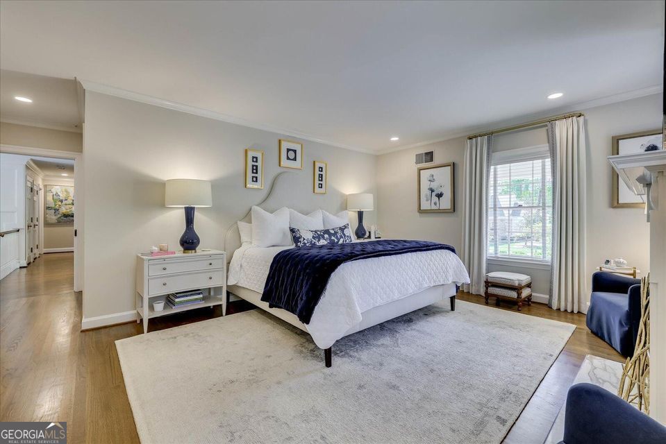5 Prather Woods Lane Augusta, GA 30909 - Photo 33 of 73 a spacious bedroom with a bed and wooden floor