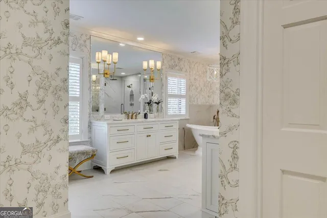 a en suite bathroom with double vanity and a mirror