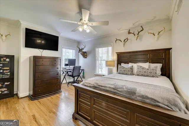 a dining room with furniture window and wooden floor