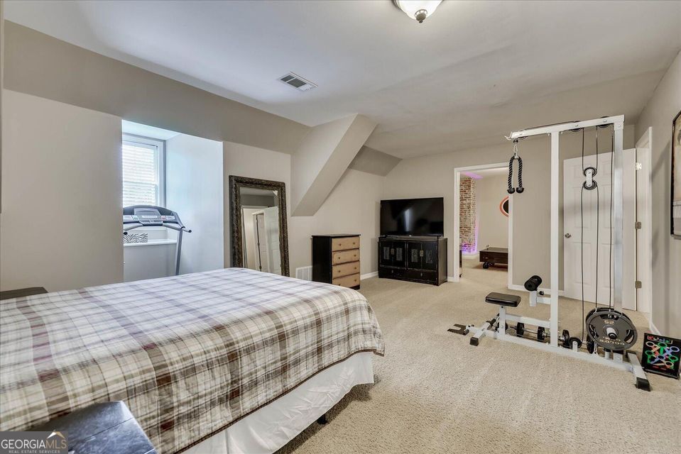 5 Prather Woods Lane Augusta, GA 30909 - Photo 56 of 73 a bedroom with a bed and a flat screen tv