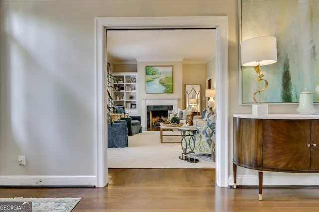 a living room with furniture and a lamp
