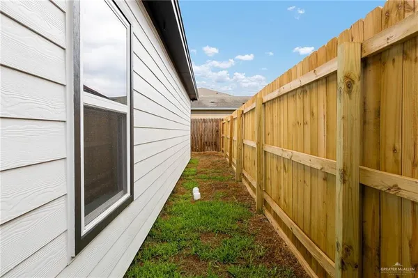 a view of a backyard with pathway