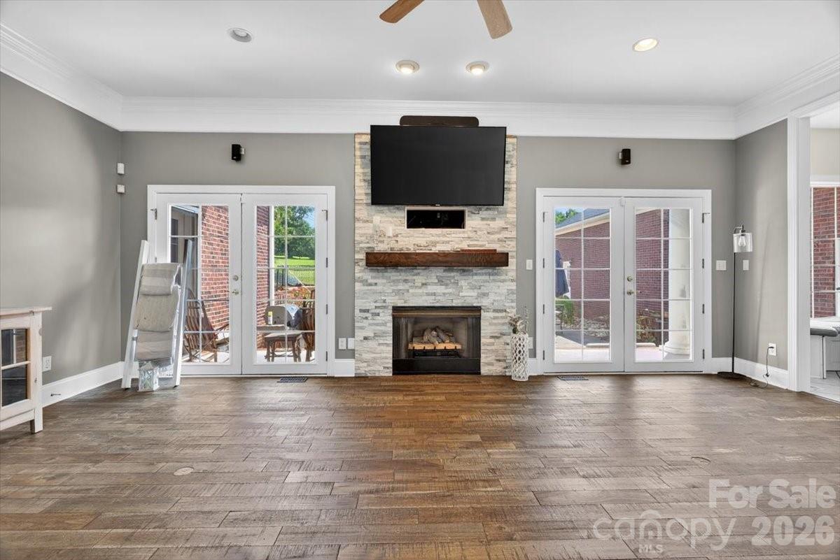 498 Johnson Dairy Road Mooresville, NC 28115 - Photo 18 of 43 a view of a livingroom with fireplace and window