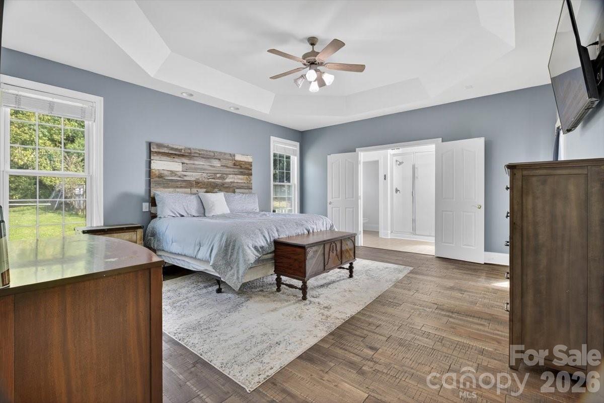498 Johnson Dairy Road Mooresville, NC 28115 - Photo 20 of 43 a spacious bedroom with a bed and a table