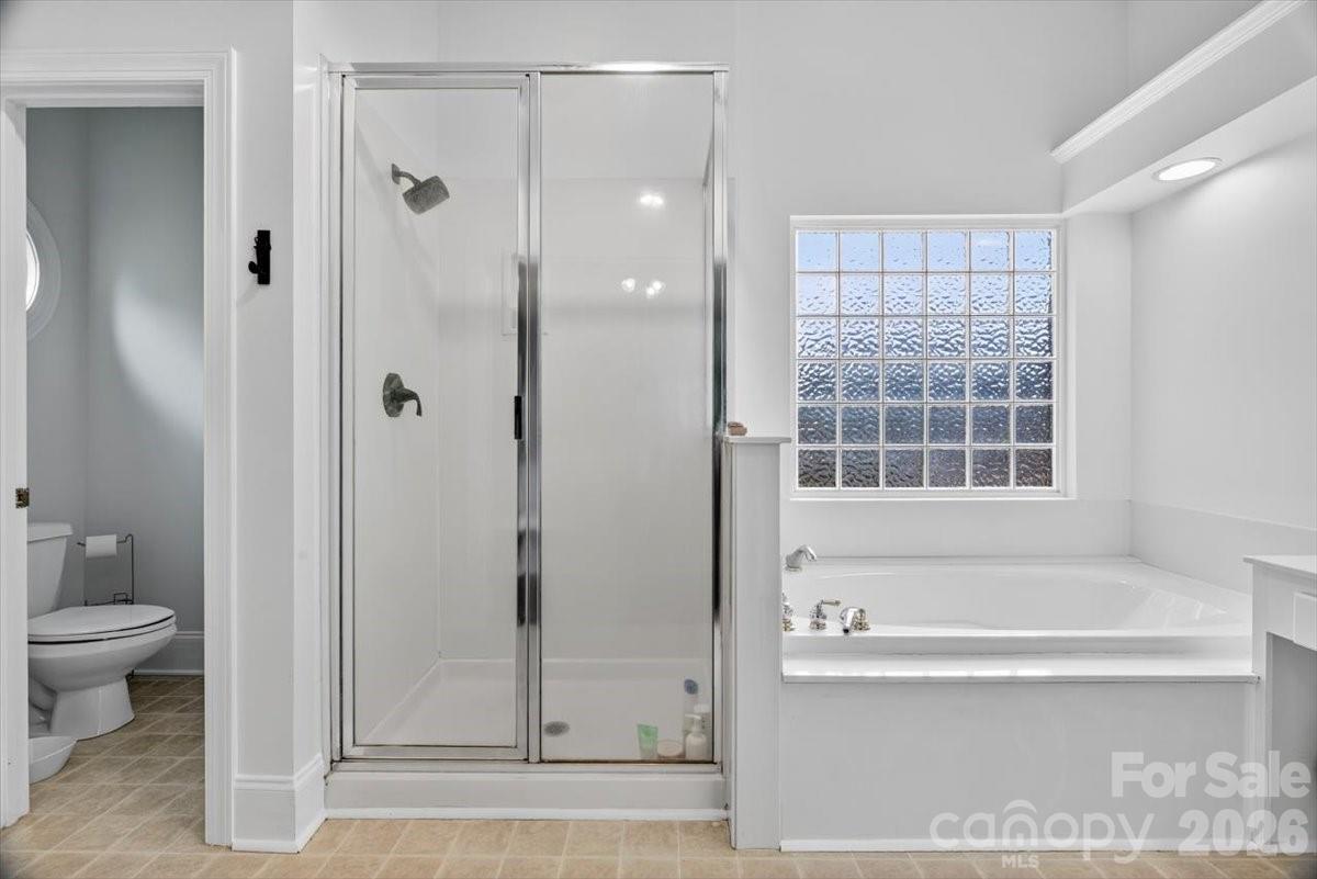498 Johnson Dairy Road Mooresville, NC 28115 - Photo 23 of 43 a bathroom with a bathtub and a shower