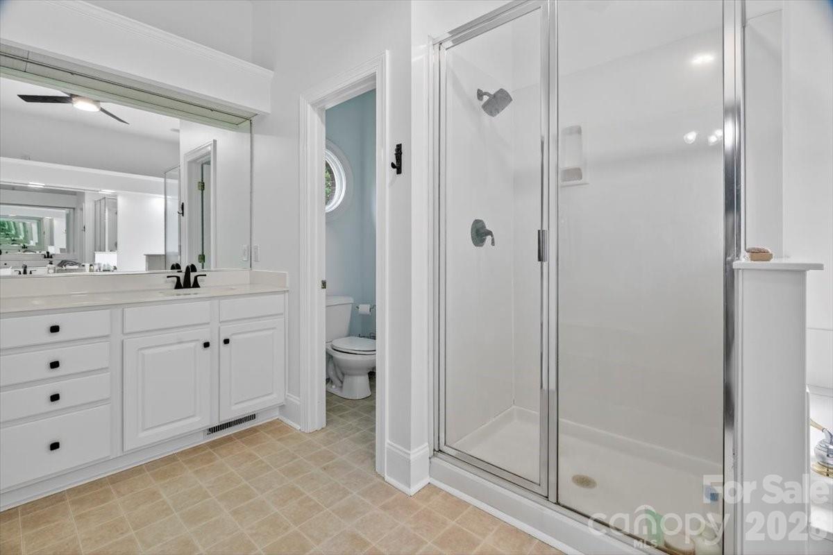 498 Johnson Dairy Road Mooresville, NC 28115 - Photo 24 of 43 a spacious bathroom with a shower sink and mirror