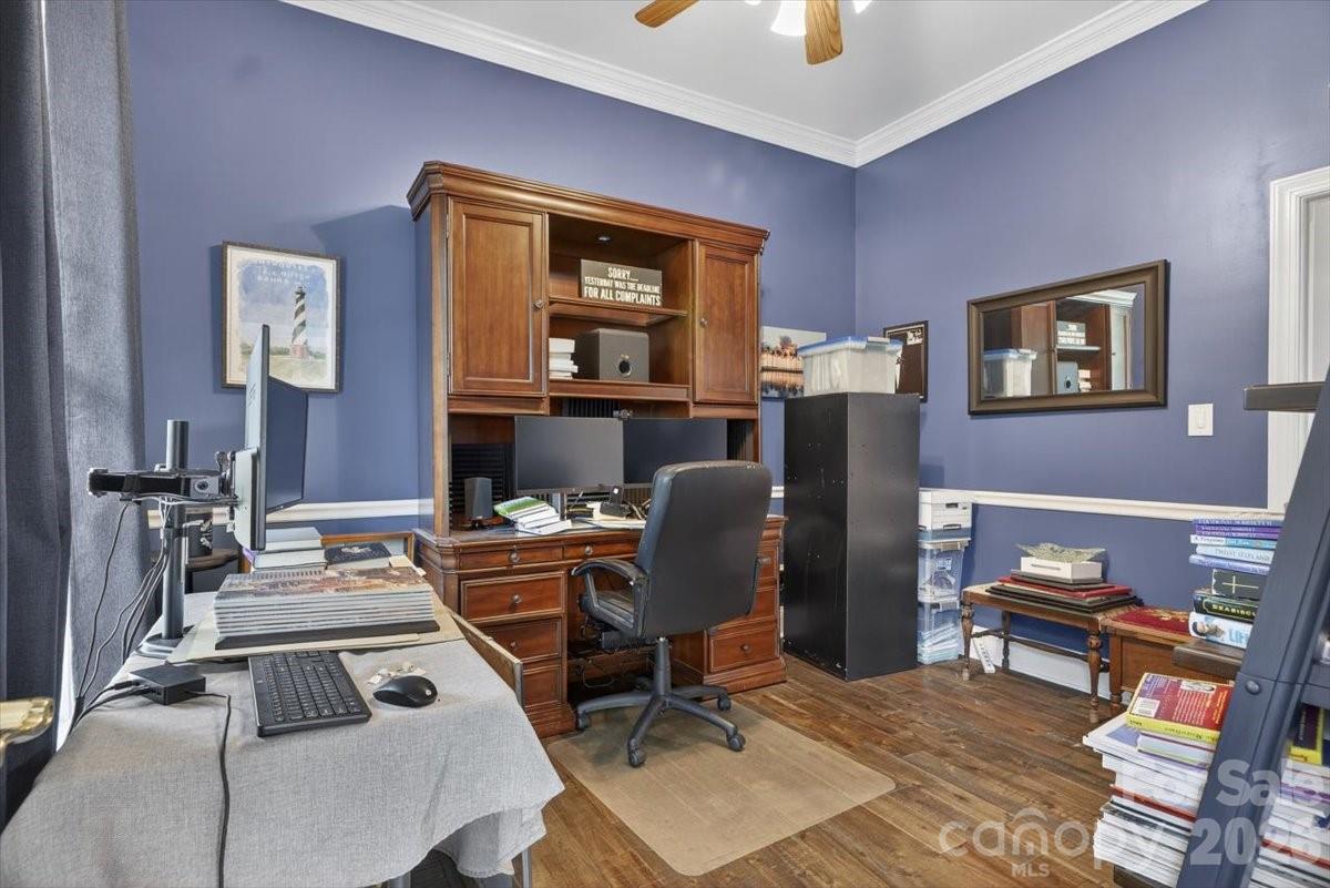498 Johnson Dairy Road Mooresville, NC 28115 - Photo 25 of 43 a work room with furniture and a flat screen tv